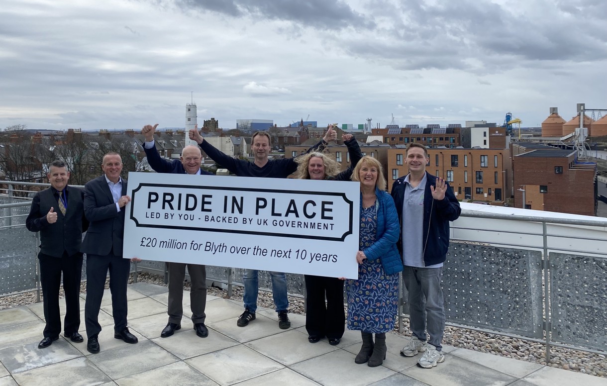 image shows members of Blyth's Pride in Place Board welcoming the announcement